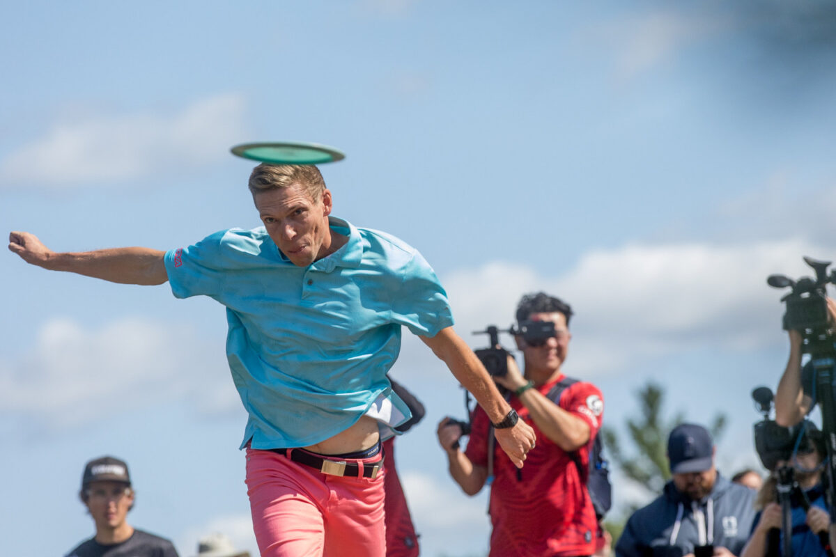 Innova Pro Joel Freeman throwing a drive during a disc golf tournament.